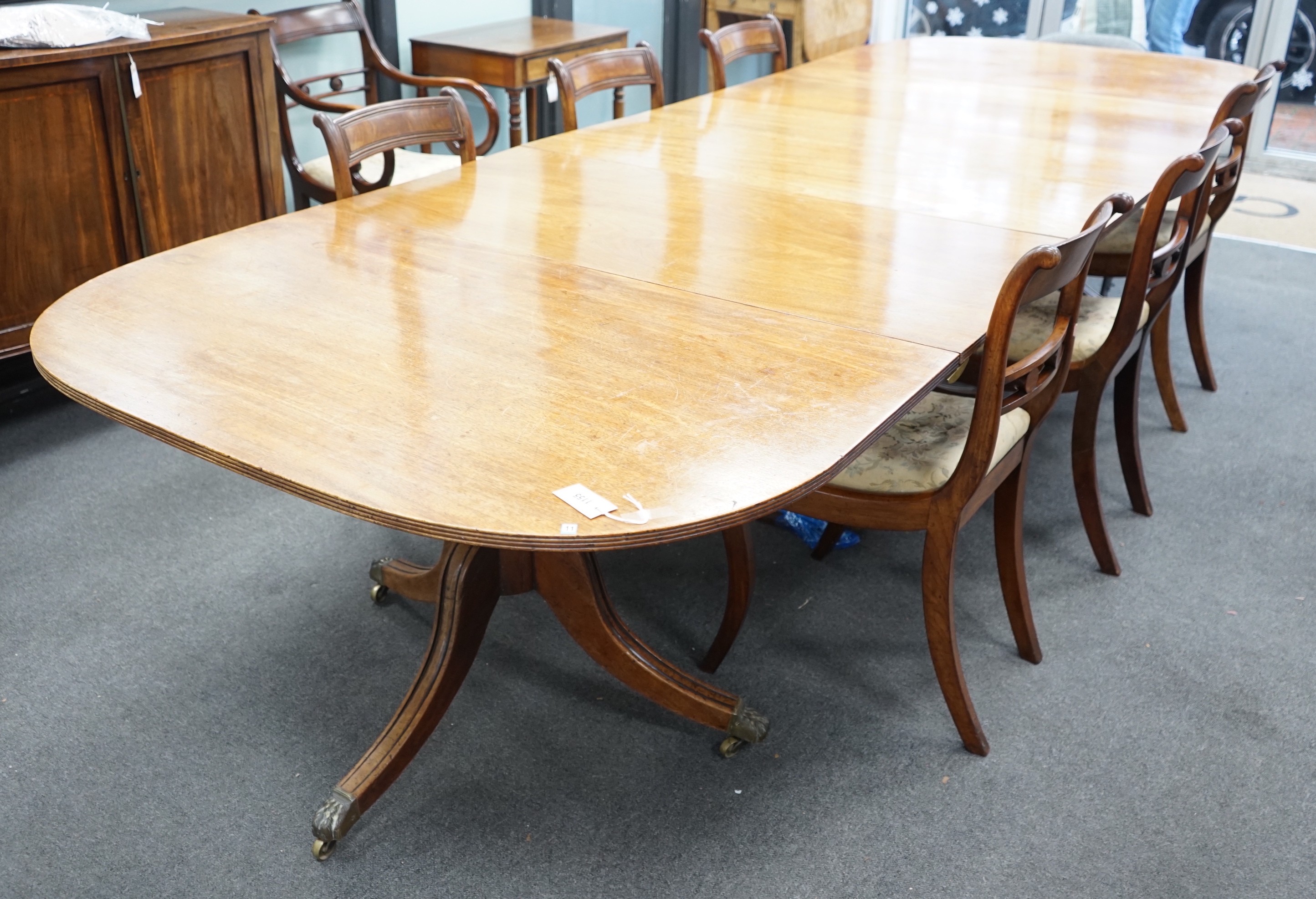 A George IV mahogany triple pedestal extending dining table, length 341cm extended, two spare leaves, width 124cm, height 70cm